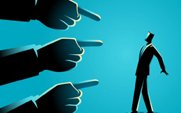 Fingers pointing accusingly at man