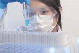 Scientist holding a vial