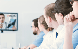 Attendees watching a virtual program