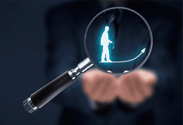 Magnifying glass identifying an expert