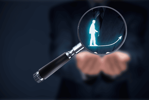 Magnifying glass identifying an expert